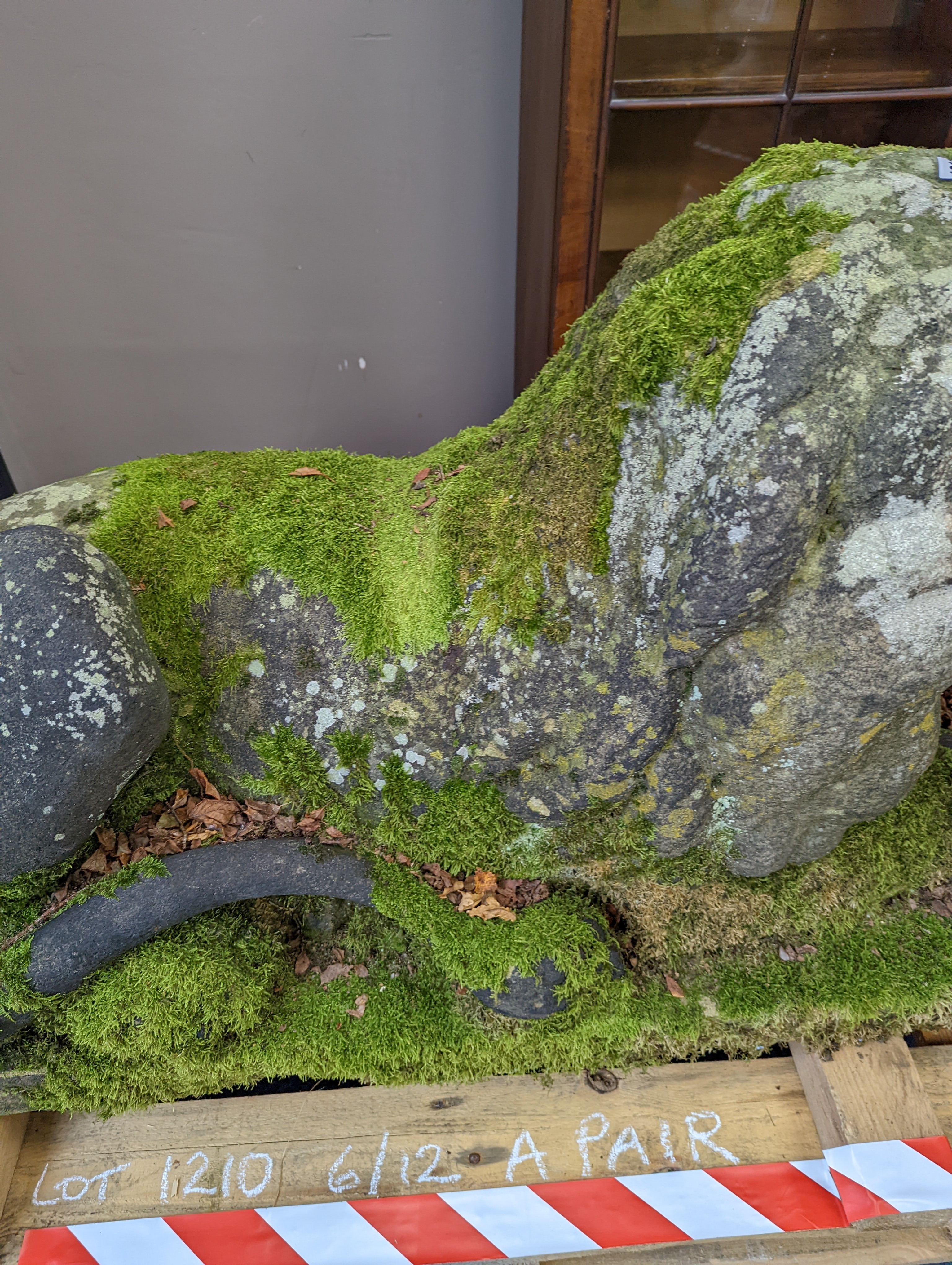 A pair of carved stone models of a recumbent lion and lioness, purchased from Crowther of Syon Lodge approximately 40 years ago. Length 122cm. Width 50cm. Height 60cm.